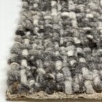 Close-up of textured woven wool rug