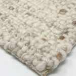 Close-up of a textured wool carpet.