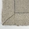 Close-up of woven beige fabric texture.
