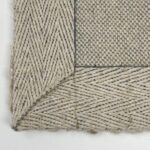 Close-up of woven beige fabric texture.