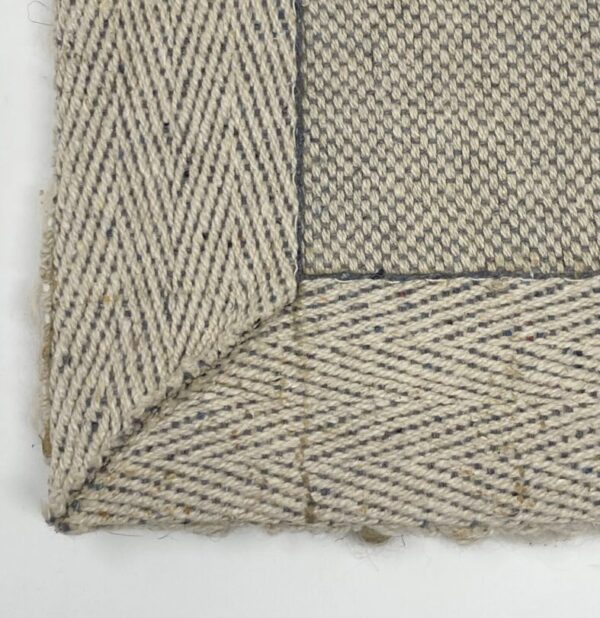 Close-up of woven beige fabric texture.