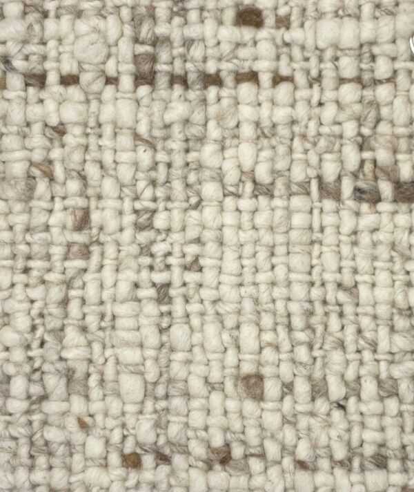 Beige textured woven fabric close-up