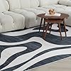 Modern abstract wave rug in living room.