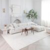 Modern living room with white sectional sofa.