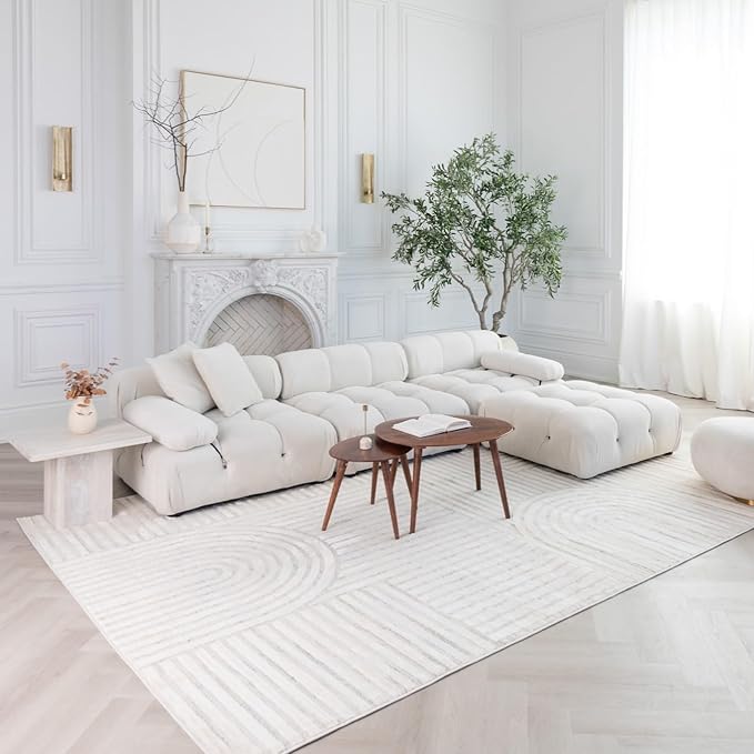 Modern living room with white sectional sofa.