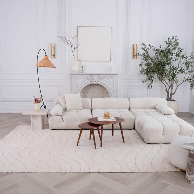 Elegant living room with white sectional sofa.