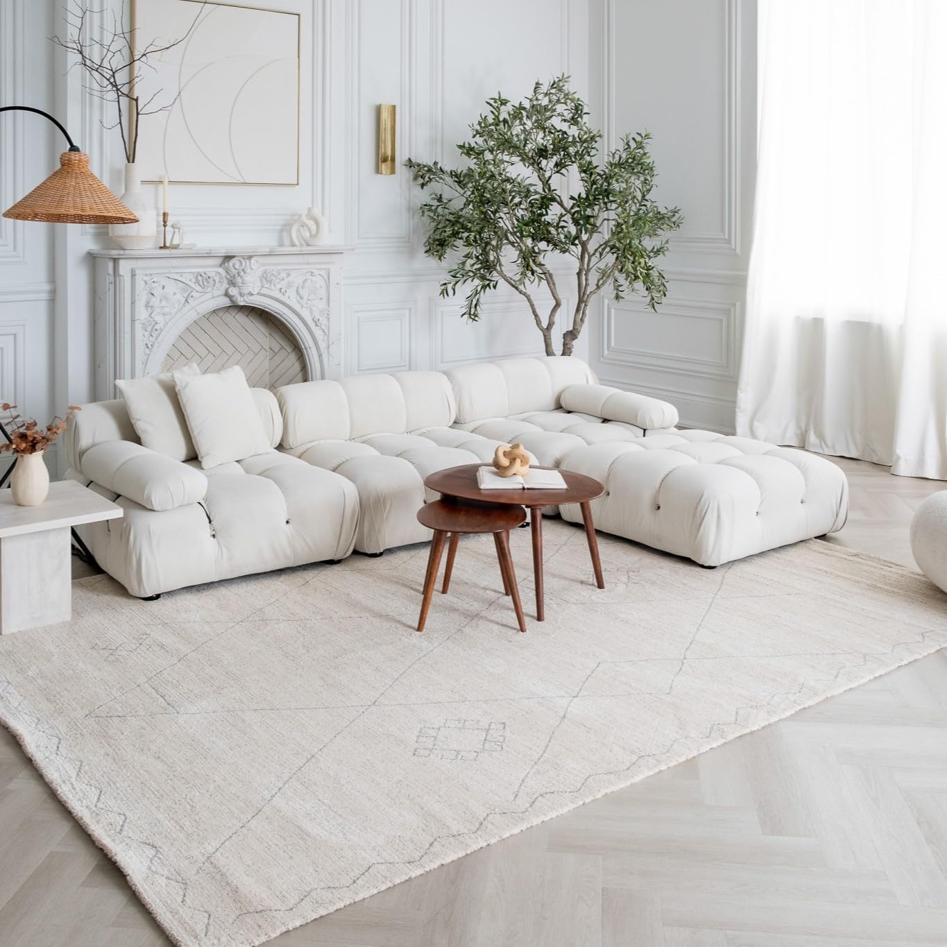 Elegant living room with white sofa and decor.
