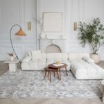 Modern living room with white sofa and decor.