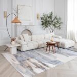Elegant living room with white sofa and decor.