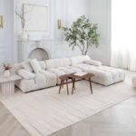 Elegant white living room with modern furniture.
