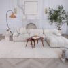Modern living room with white sofa and decor.