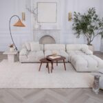 Modern living room with white sofa and decor.