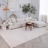 Elegant living room with white sofa and decor.