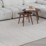 Wooden tables with book on beige carpet