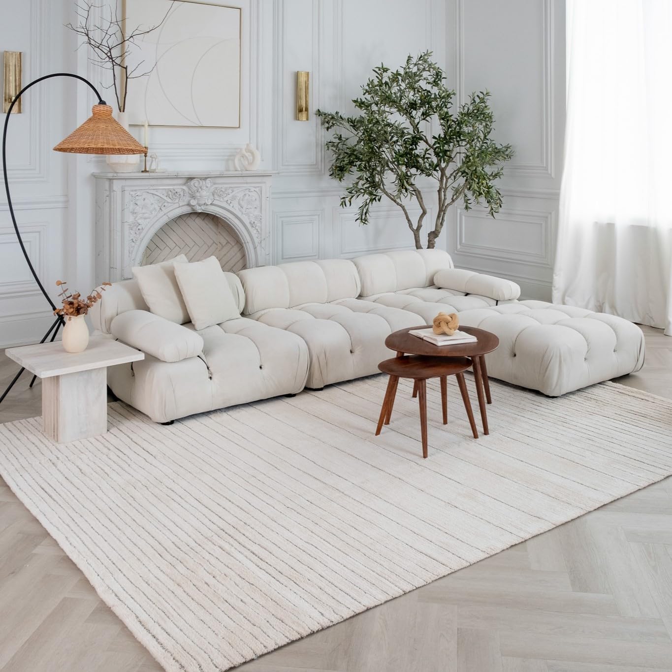 Modern living room with white sofa and decor.