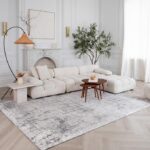 Elegant living room with white sectional sofa.