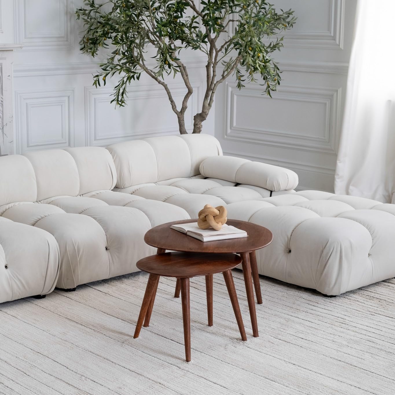 Modern living room with white sofa and tables
