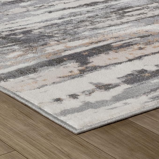 Abstract patterned rug on wooden floor