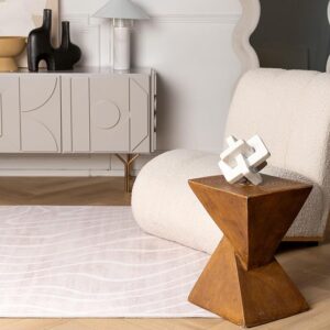 Modern living room with abstract decor and furniture.