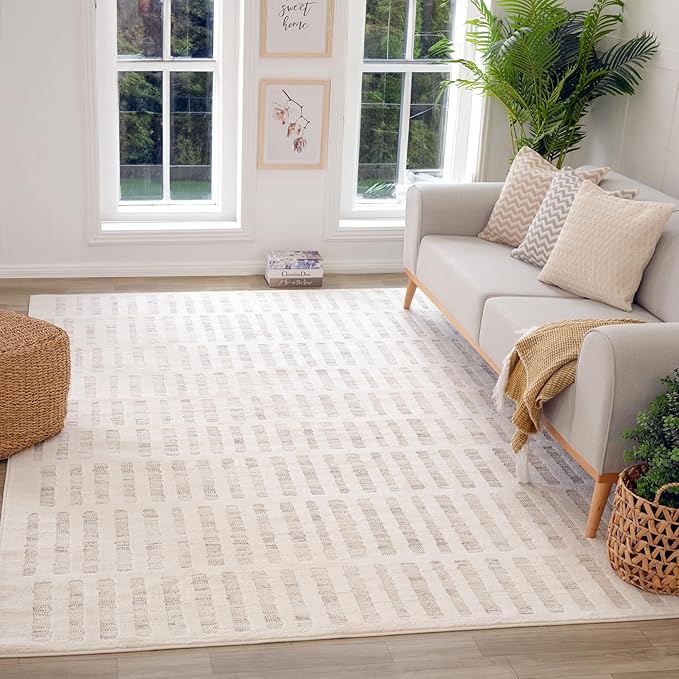 Cozy living room with patterned rug, sofa, plants