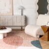 Modern living room with geometric decor and rug
