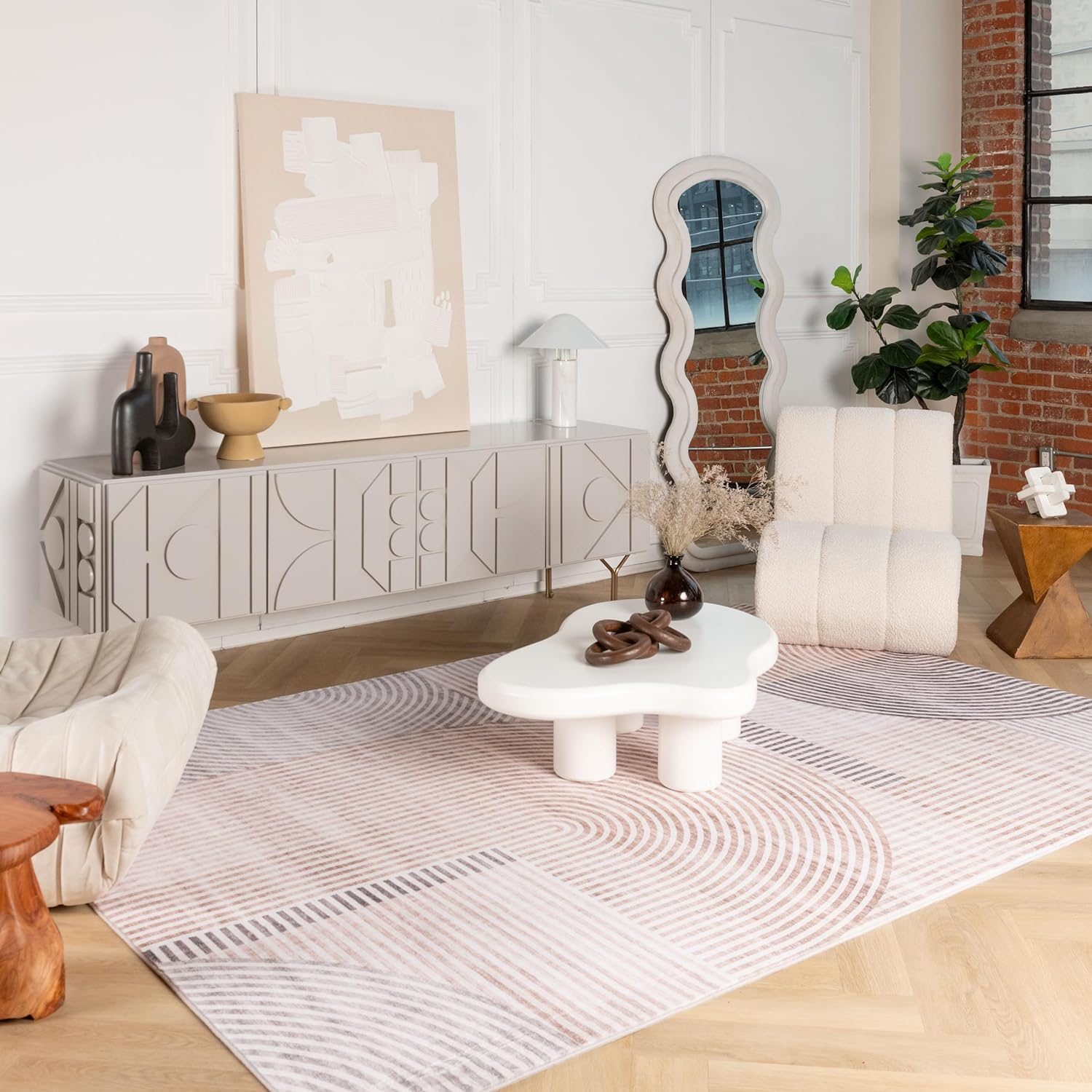 Modern living room with abstract décor and furniture.