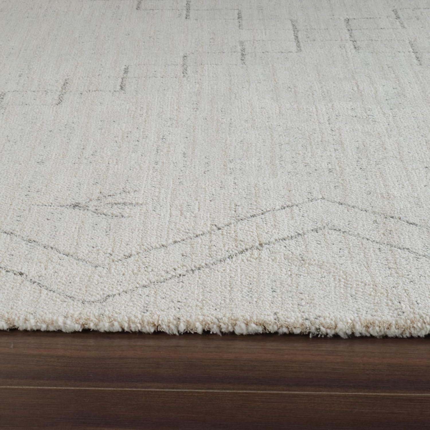 Beige textured rug with subtle geometric pattern