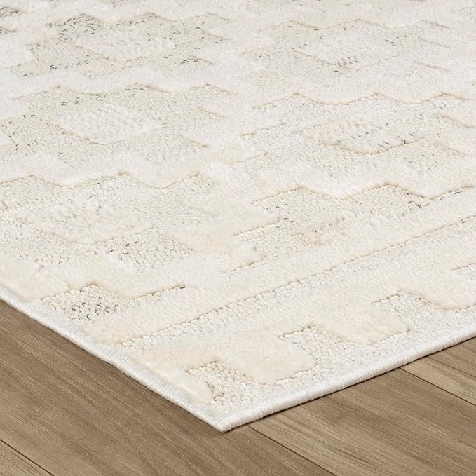Textured white rug on wooden floor