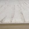 Close-up of textured beige carpet on the floor.