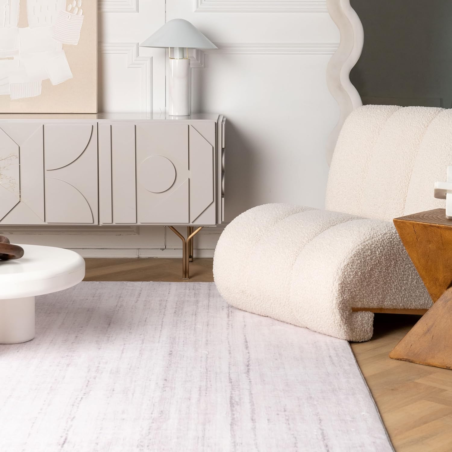 Modern living room with plush chair and cabinet