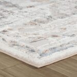 Textured cream area rug on wooden floor