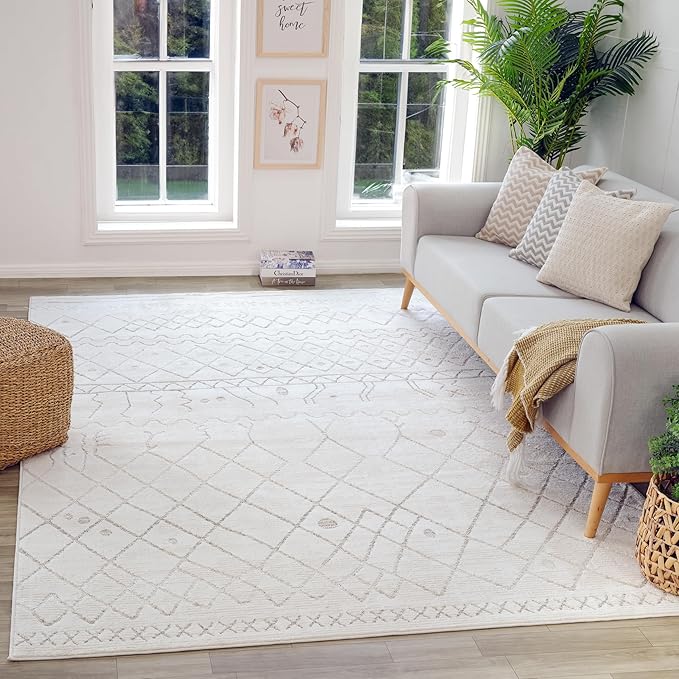 Bright living room with patterned white rug.