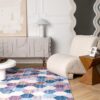 Modern living room with geometric rug and armchair