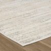 Beige textured rug on wooden floor