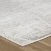 Textured white rug on wooden floor