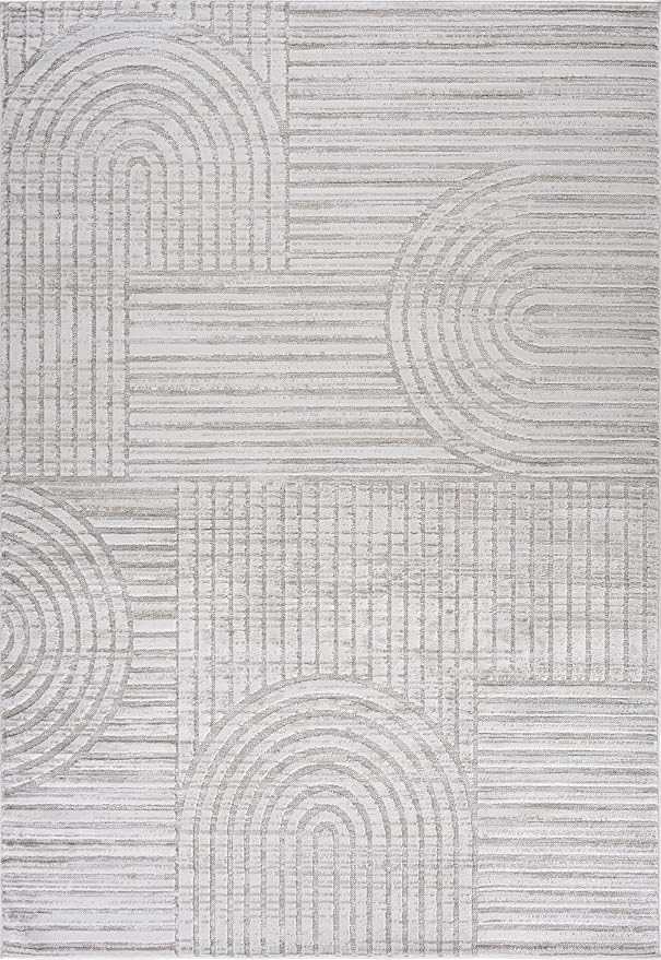 Geometric gray and white patterned rug design.