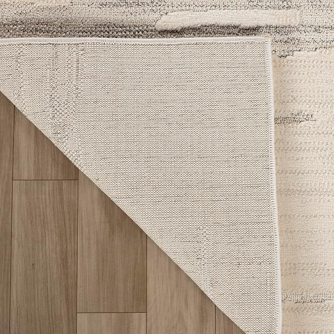 Corner of rug folded on wooden floor