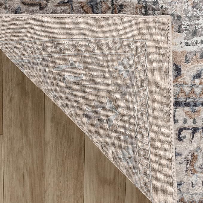 Detailed patterned rug on wooden floor