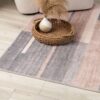 Striped area rug with vase and basket