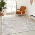 Modern living room with chair and vintage rug.