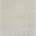 White fabric with zigzag embroidered patterns.