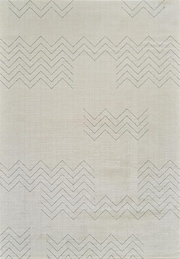 White fabric with zigzag embroidered patterns.