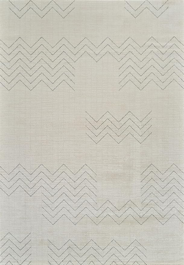White fabric with zigzag embroidered patterns.