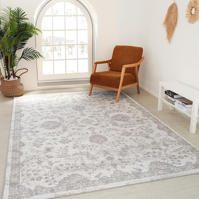 Cozy room with floral rug and armchair.