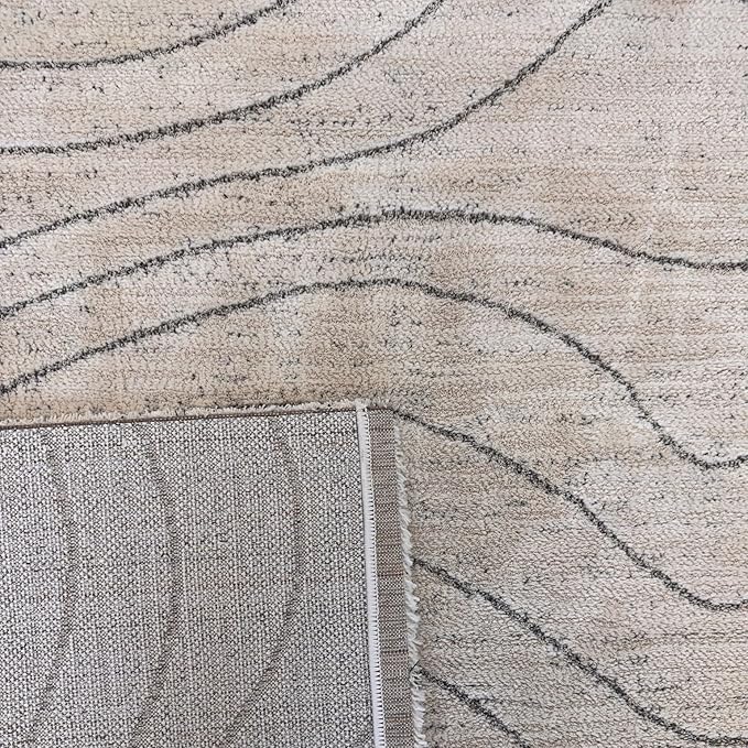 Beige rug with wavy gray lines, close-up view.