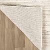 Rug corner flipped over wood floor