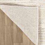 Rug corner flipped over wood floor