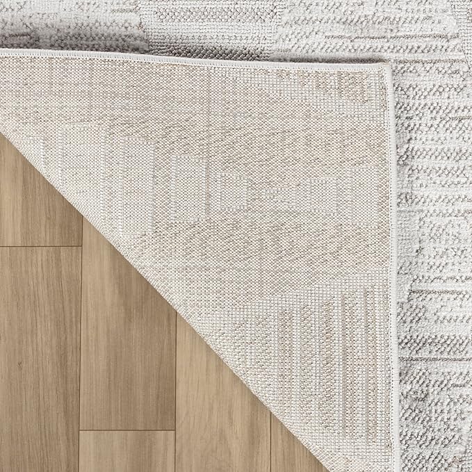 Corner of a rug on wood floor