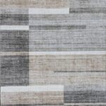Abstract gray and beige patterned rug design.