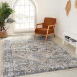 Stylish living room with patterned rug and chair